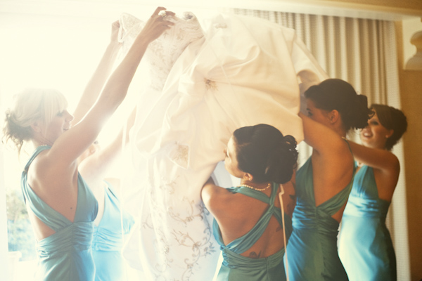 bridesmaids surrounding happy bride - wedding photo by top Orange County, California wedding photographers D. Park Photography